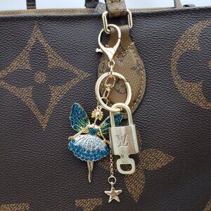 Authentic Louis Vuitton Lock & Key with Unbranded Fairy Charm, Keychain